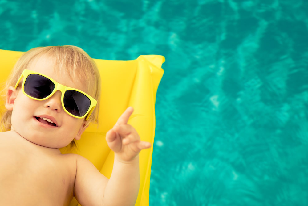 funny-baby-boy-in-swimming-pool-QT8PA3ELow